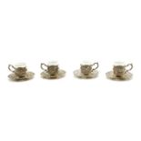 A set of German silver coffee can holders and saucers,