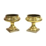 A pair of large modern brass urns,