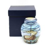 A Moorcroft tubeline decorated 'Winds of Change' jar and cover,