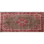 A Persian wool rug,