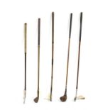 A mixed collection of vintage hickory shafted golf clubs,