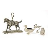 A silver plated model of a dog,
