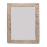 An Arts and Crafts pewter wall mirror,