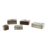 A collection of Arts and Crafts style pewter clad boxes,
