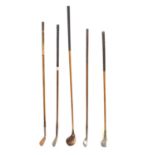 A mixed set of hickory shafted vintage golf clubs,