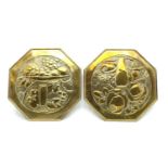 A pair of 'Arts and Crafts' design octagonal brass plaques