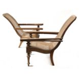 A near pair of teak planter's lounge chairs,