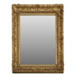 A rectangular gilt-framed mirror