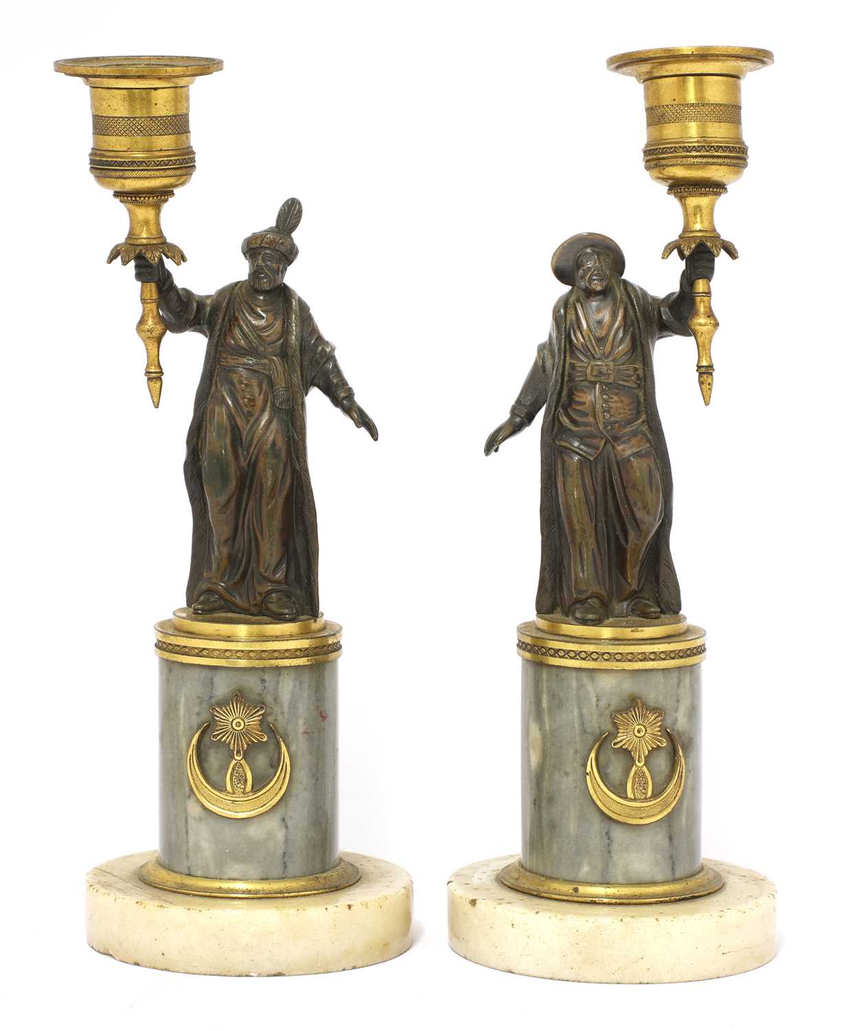 A pair of French gilt and patinated bronze figural 'gout en turc' candlesticks,