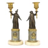 A pair of French gilt and patinated bronze figural 'gout en turc' candlesticks,