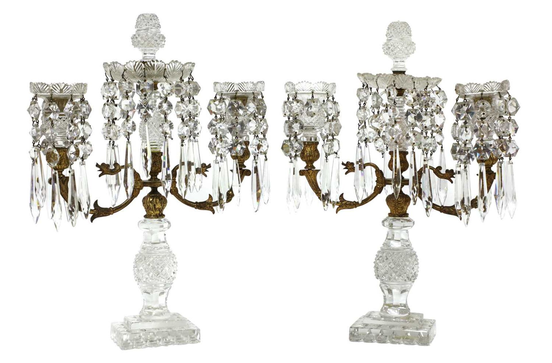 A pair of cut-glass two-branch candlestick lustres,