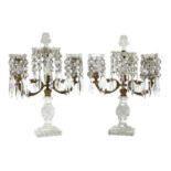 A pair of cut-glass two-branch candlestick lustres,