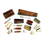 A collection of cheroot holders and pipes,