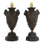 A pair of bronze table lamps,