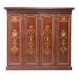 An inlaid mahogany four-door wardrobe,