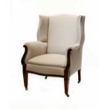 A mahogany wingback armchair,