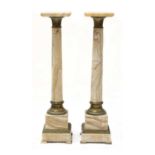 A pair of French onyx pedestals,