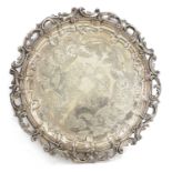 A large silver-plated circular tray,