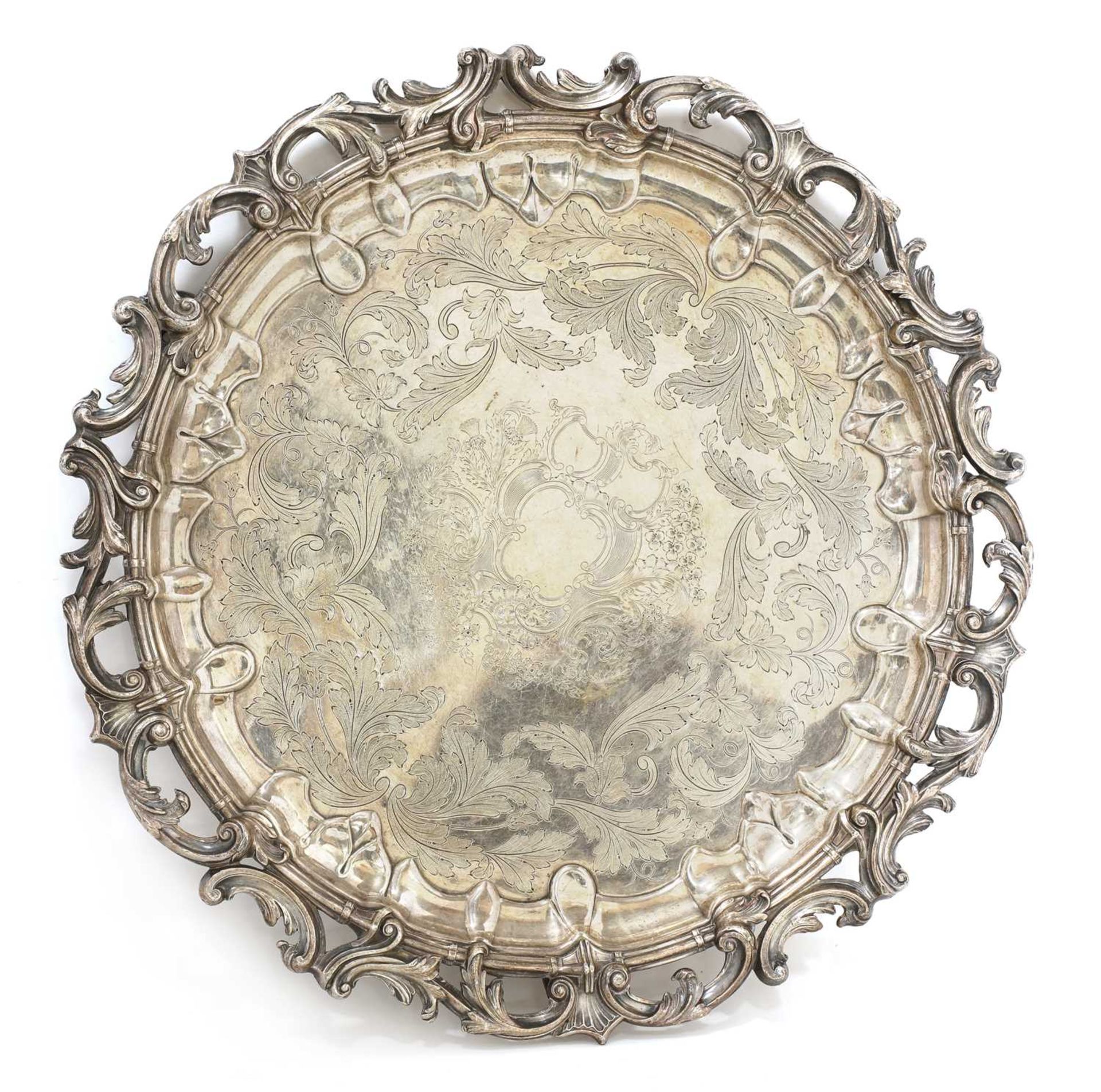 A large silver-plated circular tray,