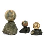 A trio of grand tour marble balls,