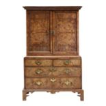 A walnut and feather banded cabinet