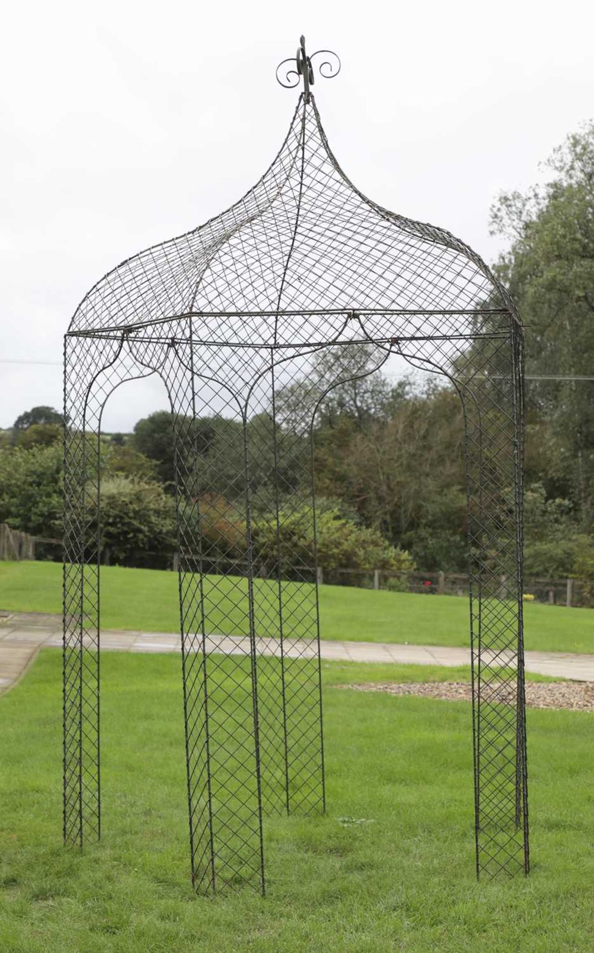 A Regency design wrought iron wirework arbour,