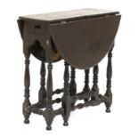 A miniature ebony gateleg table,