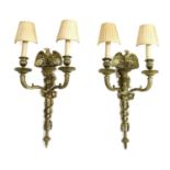 A pair of Empire design gilt metal wall lights,