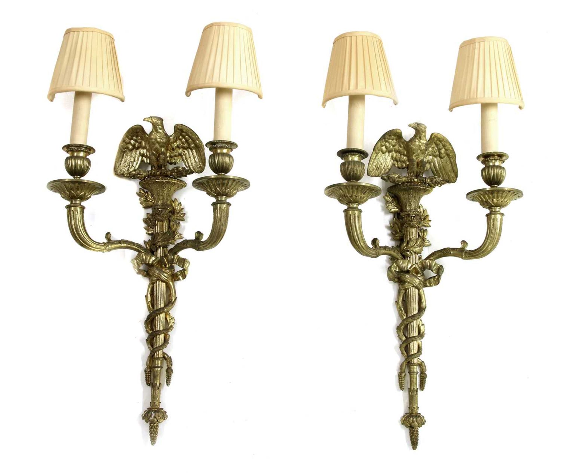 A pair of Empire design gilt metal wall lights,