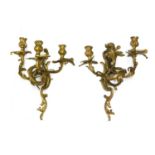 A pair of Louis XV-style bronze three-branch wall lights,