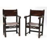 A near pair of Spanish oak armchairs,