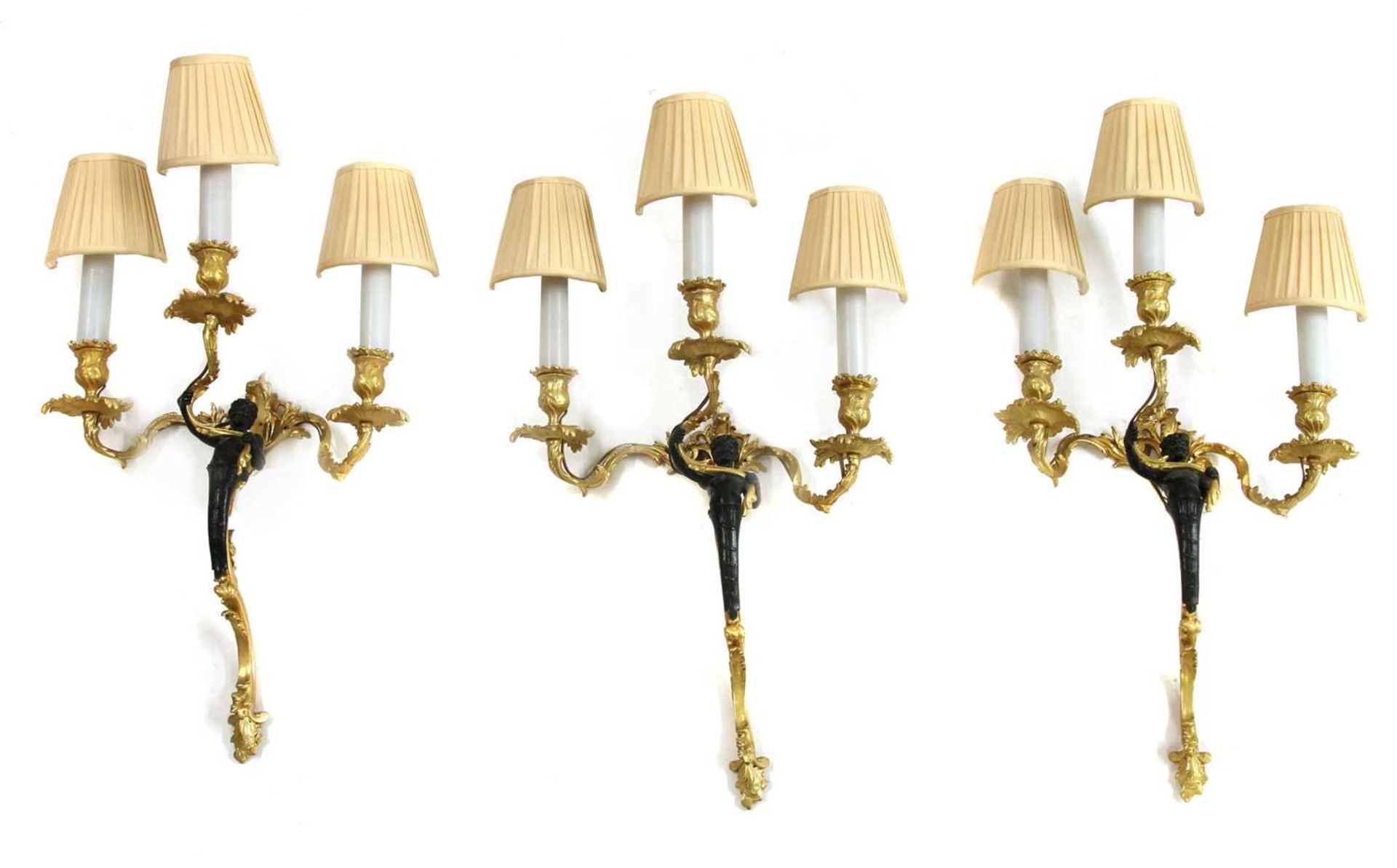 A set of three Louis XV design bronze and gilt-bronze wall lights,