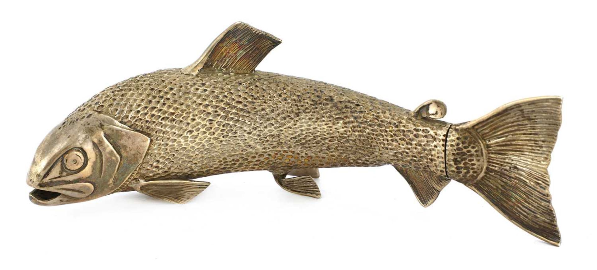 A silver pepper grinder in the form of a salmon,