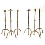 A set of six steel and brass candlesticks
