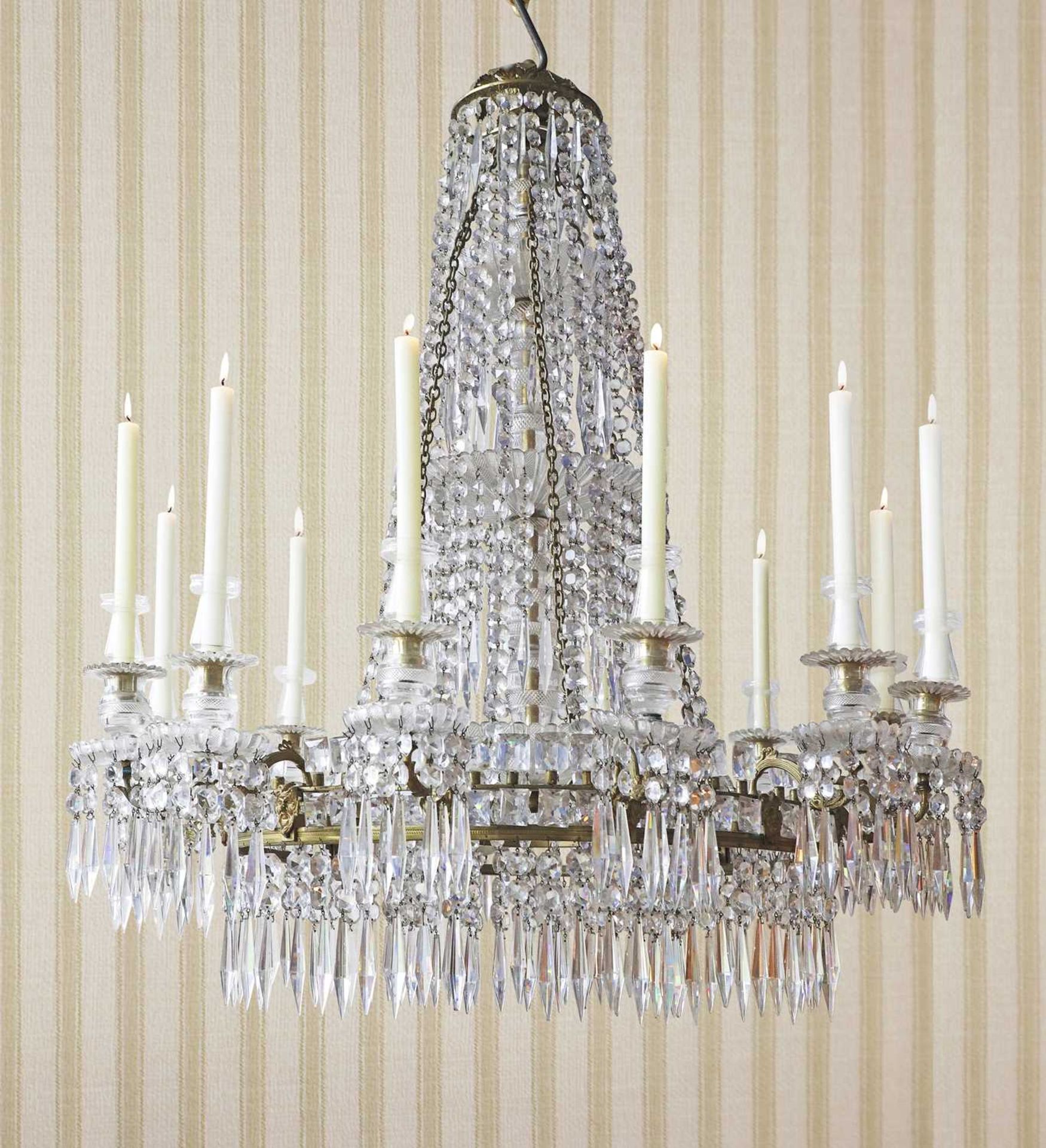 A large George III-style gilt brass and cut-glass twelve-light chandelier,