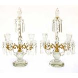 A pair of two-branch cut-glass table lustres,