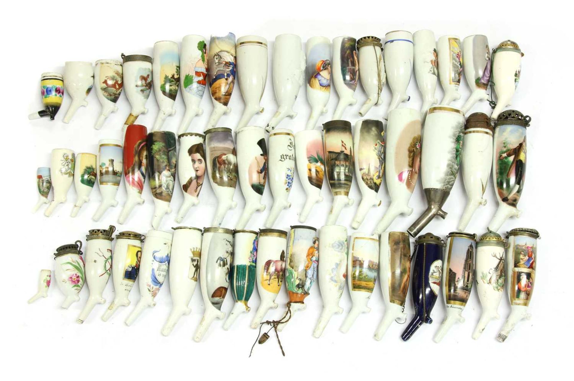 A collection of German porcelain pipe bowls,