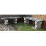 A near pair of carved limestone garden seats