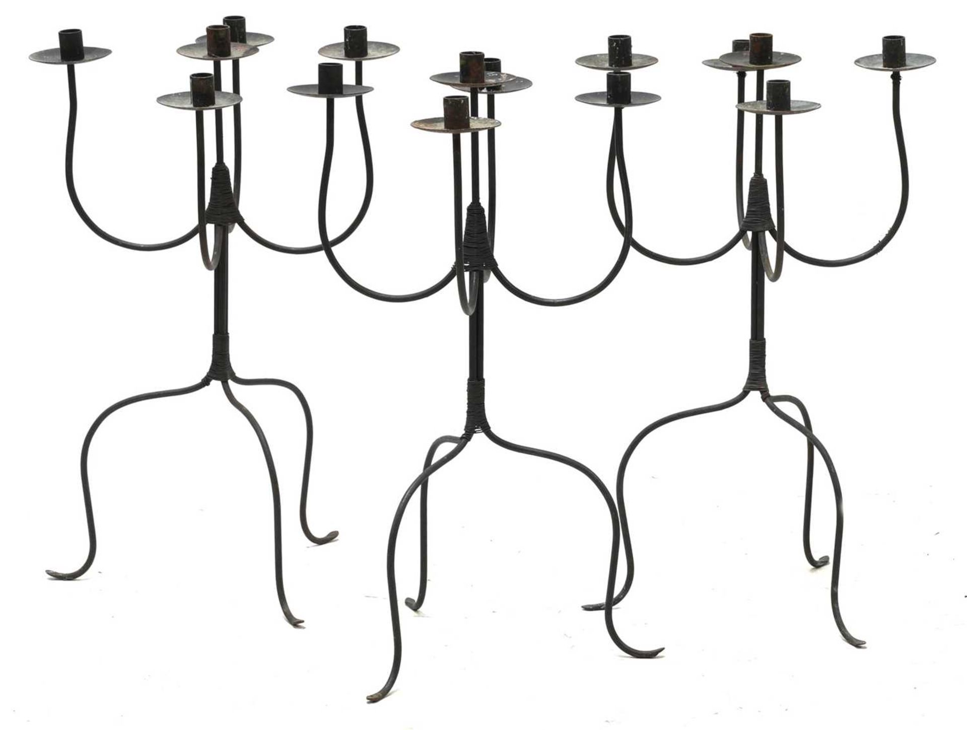 A set of three steel five-light candelabra,