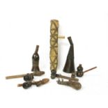 Four African section wood and leather mounted water pipes,