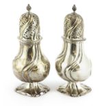 A pair of Dutch silver casters,