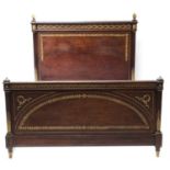 A Louis XVI-style plum pudding mahogany double bed,