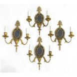 A set of four George II design gilt metal girandoles,