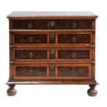 A William & Mary oyster veneered laburnum and oak chest of drawers,
