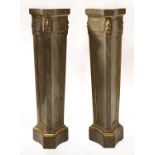 A pair of faux marble pedestals,