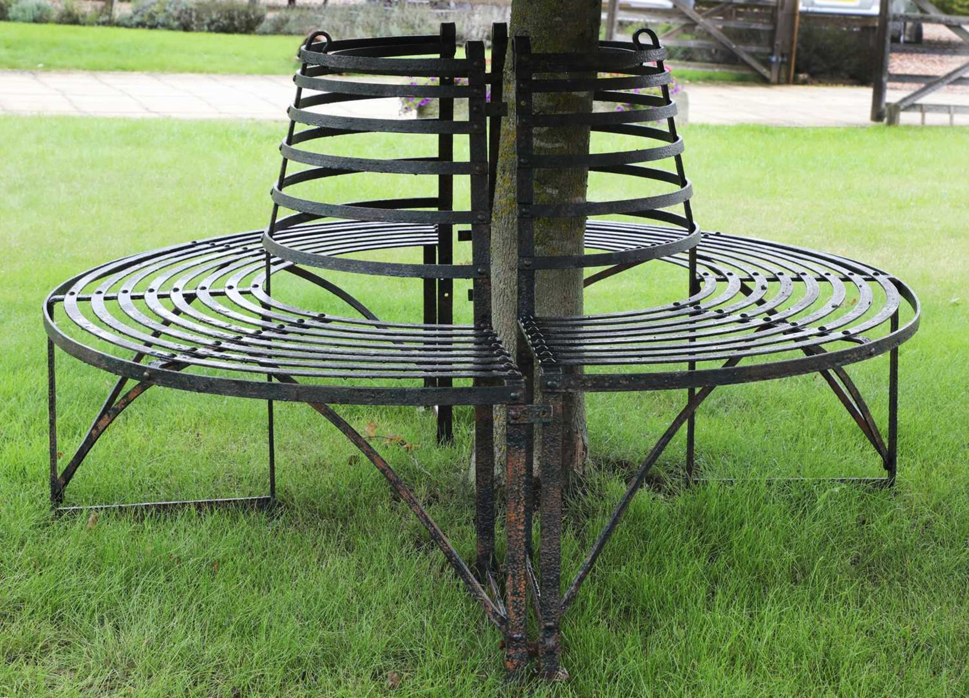 A wrought iron tree seat,