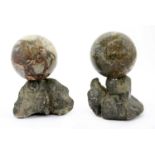 A pair of grand tour marble balls,