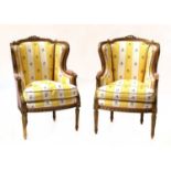 A pair of French Louis XVI-style giltwood fauteuils,