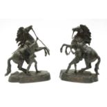 A pair of bronze Marly horses,