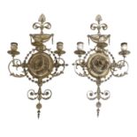 A pair of painted and gilt gesso wall appliques,
